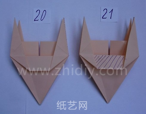 简单折纸花制作教程（详细步骤）第十一步完成之后的效果看起来更像是两个折纸的牛头了