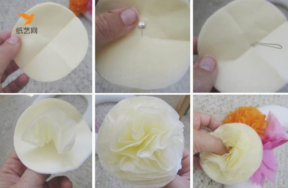 将纸剪成圆形的一叠，然后用铁丝穿过中间，一层层将纸张加工一下就成为一朵漂亮的花朵啦