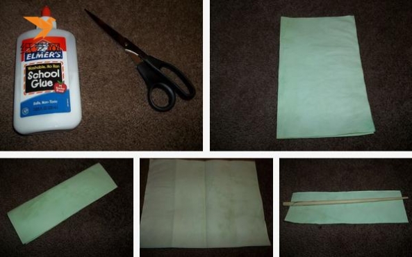 将绿色的纸张对折之后，裁成长方形，然后用筷子辅助，卷成长条