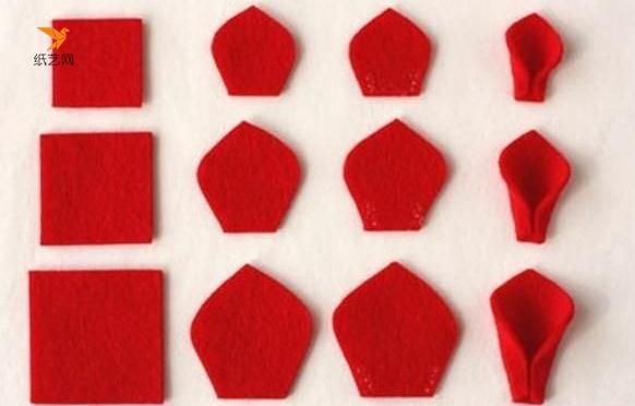 将红色的不织布裁成三种不同大小的正方形，然后在这个正方形的基础上，剪成花瓣的样子，然后卷着把底部粘好