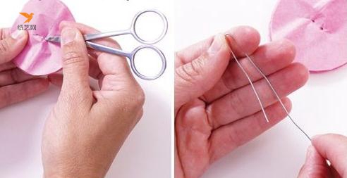 先用剪刀在圆形纸中间扎上两个孔，然后把铁丝掰弯