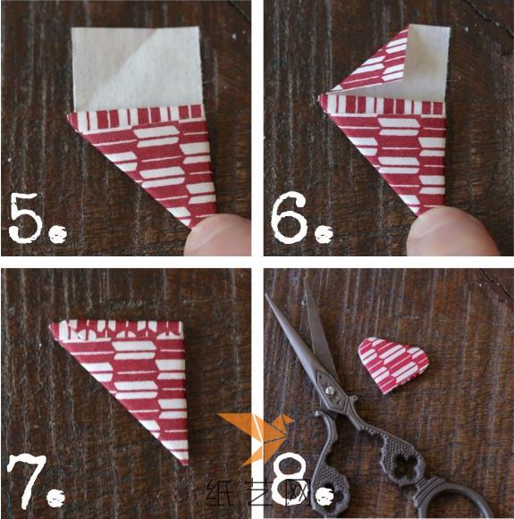 继续这样来折叠到头，然后把末端折叠一下塞到折纸心里面，用剪刀把两个角剪成弧形