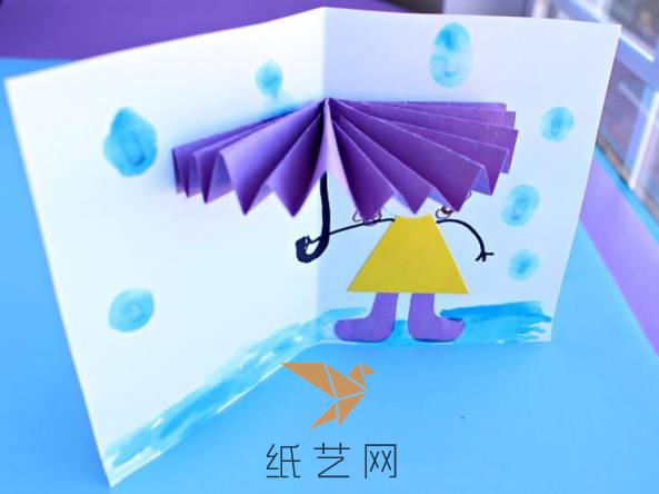 接着就可以以这个伞为基础，在贺卡上面画上小女孩和雨水