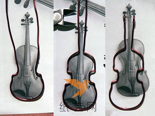 这样用钳子一点点的调整好金属丝，制作出小提琴的轮廓来