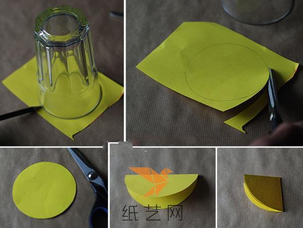 下面用杯子作为圆形的模具，将圆形画在彩纸上面，然后用剪刀剪下来，对折两次
