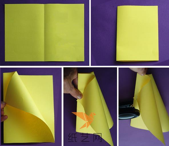 将一张A4纸大小的彩纸来制作成这个风筝，将纸张先折叠之后，然后再分别卷起来
